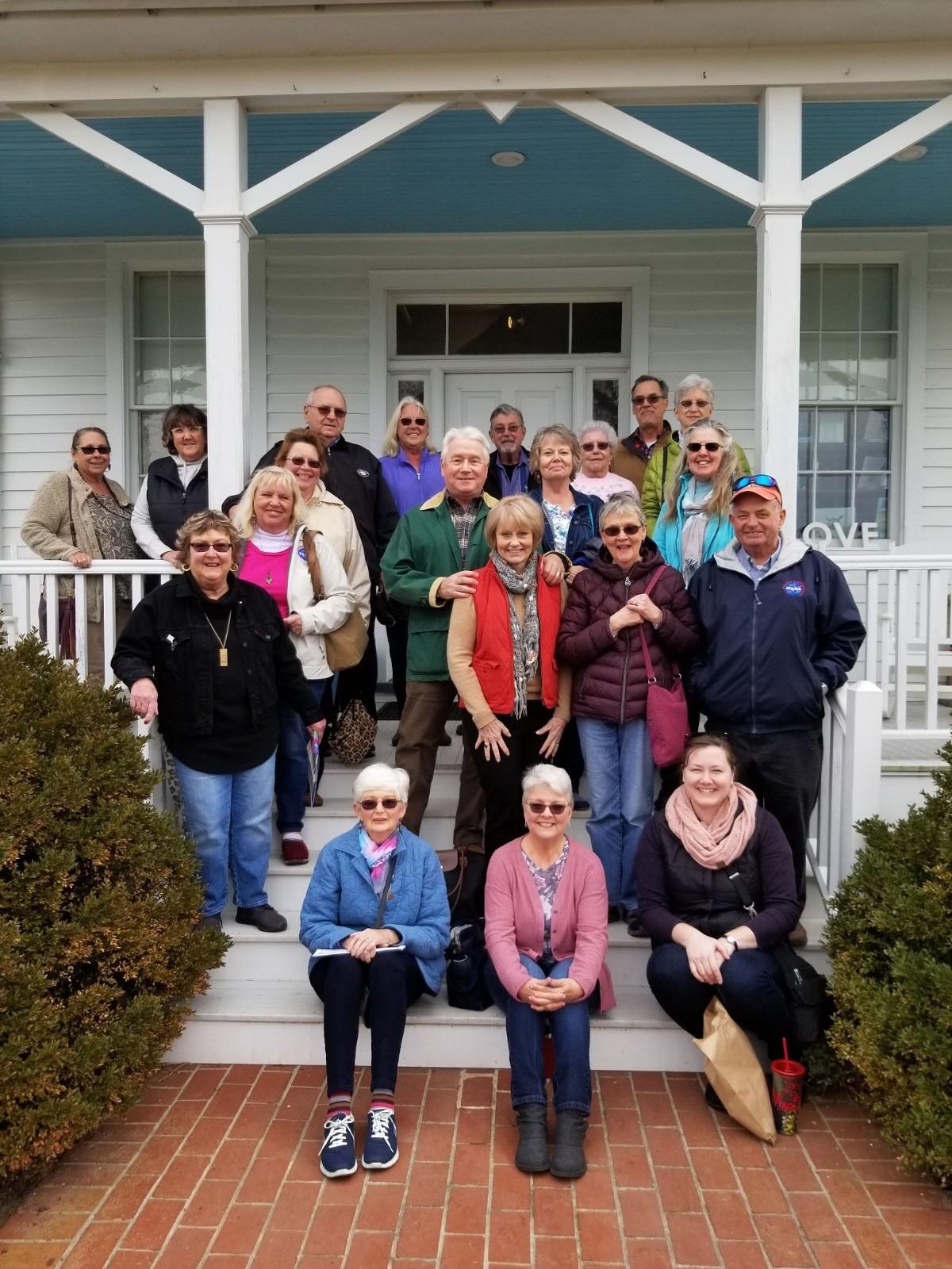 Museum volunteers smiling for a photo
