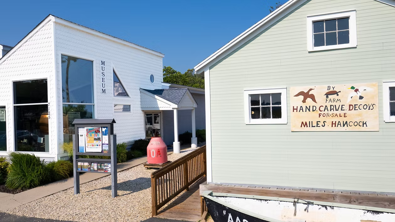 Two buildings next to each other with signs outside